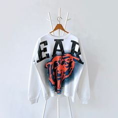 90s Chicago Bears NFL sweatshirt/ L * PLEASE READ BEFORE PURCHASE * PLEASE consider the PHOTOS before making the decision * The images may DIFFER in appearance from the actual product because we took pictures under daylight.  * PLEASE send your PHONE NUMBER after your purchase for the shipping company to contact you X No returns X No refund Condition : 9/10 More details : hole (cuff)/ look at the pictures  Brand : Pure magic  Size : L Pit to pit/ Chests : 24/48 inches  Length : 26 inches  Material : cotton polyester  Color : white  * ALL ITEMS are VINTAGE which may show some signs of wear and tear * Due to the different display and different light, the picture may not reflect the actual color of the item * Please, remember that our items are vintage so they may show some signs of wear, tea Oversized Hip Hop Sweatshirt For College, 90s Long Sleeve Streetwear Sweatshirt, 90s Style Long Sleeve Streetwear Sweatshirt, Oversized Hip Hop Sweatshirt With Screen Print, Streetwear Sweater For Fall With Drop Shoulder, Streetwear Fall Sweater With Drop Shoulder, Streetwear Drop Shoulder Sweater For Fall, Drop Shoulder Sweater For Streetwear In Fall, Hip Hop Sweatshirt For College In Fall