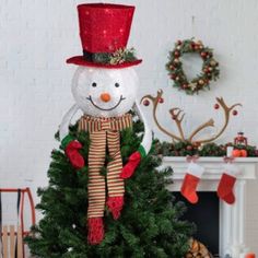 No Christmas is complete without a snowman making this unique find a must have this season. Decked out in a red top hat and matching striped scarf this tree topper is ready for the winter weather. Warm white lights offer the perfect amount of holiday glow. Product Features: Lighted snowman tree topper Pre-lit with 20 warm white lights Bulb size: mini Bulb type: incandescent 00" white lead cord If one bulb burns out the rest will stay lit Bendable wire in the arms for easy shaping Comes with repl