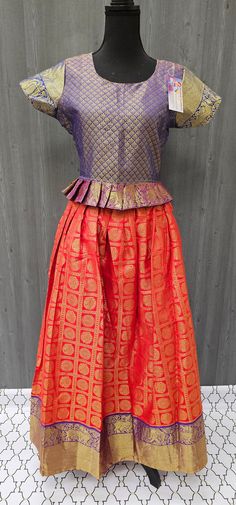 Introducing our stunning Pattu Pavadai - a South Indian traditional lehenga set - in a size 38, perfect for girls. Measuring 18 inches in blouse length, this set features a beautiful range of colorful fabrics and designer lehengas to choose from. Made from high-quality pattu material, our kids lehenga choli set is both comfortable and elegant, ensuring your young lady looks her best for any occasion. Shop our range of designer lehengas for girls now to add a touch of traditional charm to your ch Bollywood Art Silk Sets With Pallu, Anarkali Sets For Festive Occasions, Festive Anarkali Sets For Festivals, Bollywood Style Festive Sets With Pallu, Transitional Saree Sets With Pallu Design, Transitional Saree Sets With Pallu Detail, Fitted Festive Set With Tilla Details, Fitted Festive Set With Tilla, Multicolor Dress With Pallu For Puja