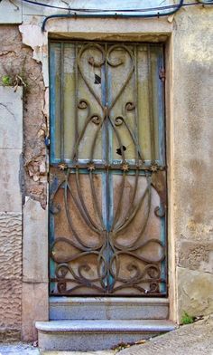 an old window with iron bars on it