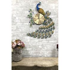 a peacock clock on the wall with flowers