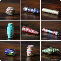 many different types of rolled up paper on a wooden table with various colors and patterns