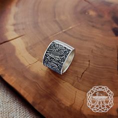 Behold our exquisite Viking Ring, a stunning homage to the Mammen Style and inspired by the intricate design from the renowned Cammin Casket. * Material: 925 Sterling Silver * Weight - approx. 21 grams (0.74 oz) This sterling silver ring is a true work of art, blending the essence of Viking craftsmanship and history. Its design draws inspiration from the artistic motifs found on the Cammin Casket, reflecting the deep connection Vikings had with their art and heritage. The Mammen Style, known for its detailed patterns, is beautifully captured in this ring, offering a captivating blend of tradition and beauty. Crafted from high-quality sterling silver, this ring embodies the elegance and durability that characterizes Viking jewelry. Its design showcases an array of Viking symbols, invoking t Viking Style Engraved Ring As Gift, Handmade Viking Style Ring Jewelry, Medieval Sterling Silver Engraved Rings, Medieval Engraved Sterling Silver Rings, Viking Style Sterling Silver Ring, Handmade Viking Ring As A Gift, Handmade Viking Style Ring As Gift, Handmade Viking Style Ring For Gift, Medieval Style Silver Engraved Ring As Gift