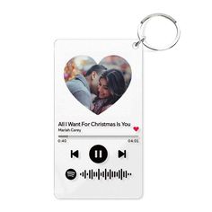 a white key chain with an image of a couple