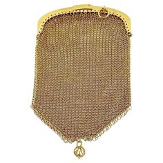 This Antique French 18 karat Yellow Gold Mesh Coin Purse Pendant is a charming and unique piece of jewelry with a rich history. Handcrafted with meticulous attention to detail, this pendant captures the elegance and craftsmanship of a bygone era. Made from luxurious 18 karat yellow gold, the mesh design of the pendant adds texture and dimension, creating a beautiful contrast against the smooth surfaces of the compartments. The mesh construction gives the coin purse pendant a delicate and intricate appearance, reminiscent of vintage elegance. The coin purse pendant features two compartments, providing practical functionality as well as aesthetic appeal. This allows it to serve as both a decorative pendant and a functional accessory for holding small items such as coins, keepsakes, or even a French Victorian, Vintage Elegance, Bygone Era, Functional Accessories, Mesh Design, Small Items, French Antiques, Decorative Pieces, Unique Pieces