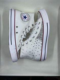 🚨READY TO SHIP🚨 This listing is for the exact product in the photo! *Video does not do it justice* The✨sparkle✨is real!! Authentic Hand rhinestoned Converse Allstar in optical white with silver rhinestones. ‼️ Size men 6 woman's 8  💎Sizing info: A great way to find your Converse size is by manually measuring your foot. Stand on a piece of paper straight against a wall. Get someone to mark the top of your top and the back of your heel and then measure the distance between these two points. Thi Glitter High-top Sneakers For Streetwear, White High-top Sneakers With Rhinestones, White High-top Custom Sneakers With Rhinestones, Bling Converse, White Canvas Shoes, Canvas Shoes Women, Silver Rhinestone, White Canvas, Canvas Shoes