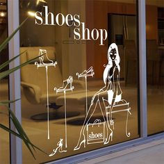 there is a store window that has shoes on display in the window and an image of a woman's legs