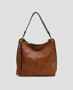 Expertly crafted from high-quality materials, the Amber Hobo Bag is the perfect accessory for any stylish and practical woman. With its spacious design, it is able to hold all of your essentials while still maintaining a sleek and fashionable look. Elevate your everyday style with this must-have bag. Large Capacity Double Handle Hobo Bag For On-the-go, Brown Bag With Large Capacity For On-the-go, Classic Rectangular Hobo Bag For On-the-go, Versatile Brown Bucket Bag For On-the-go, Versatile Satchel Hobo Bag For On-the-go, Detachable Strap Hobo Tote Bag For On-the-go, Versatile Handheld Box Bag For On-the-go, Chic Hobo Bag With Adjustable Strap For On-the-go, Versatile Everyday Top Handle Bag