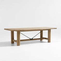 a wooden table sitting on top of a white floor