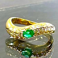 A Beautiful New Without Tags 18k Yellow Gold Center Oval Cut Emerald Measures 4.5mm X 3.5mm = .25ct With Nice Color 24 Pav Set Round Brilliant Cut Diamonds- 1.5mm Each = .40cttw Diamonds Ring Size 6.25 4.2 Grams Elegant Emerald Ring In Yellow Gold With Tension Setting, Yellow Gold Emerald Ring With Tension Setting, Elegant Yellow Gold Emerald Ring With Tension Setting, Yellow Gold Emerald Ring With Tension Setting For Anniversary, Anniversary Emerald Ring With Tension Setting In Yellow Gold, Anniversary Yellow Gold Emerald Ring With Tension Setting, Pave Diamond Ring, Emerald Diamond, Round Brilliant Cut Diamond