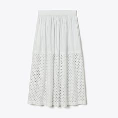 Our cotton skirt is crafted from lightweight cotton voile, a comfortable, breathable fabric that packs up easily. Cut for a mid length, subtle pleats and graphic broderie anglaise add volume and texture. A versatile piece to wear over a swimsuit or with the coordinating top for a matching set. Eyelet Skirt, Embroidered Napkins, Embroidered Tunic, Layered Skirt, Office Casual, Cotton Skirt, Cotton Voile, Matching Top, White Skirts