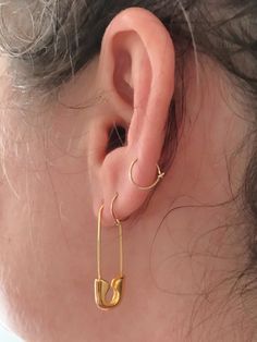 These edgy earrings are large safety pins. Pin clips at bottom of earring. Choose from gold plated or white gold (silver) plated. 1.25" long. Edgy Gold Earrings, Safety Pin Earrings Aesthetic, Gold Safety Pin Earrings, Everyday Safety Pin Single Earring, Edgy Gold Hoop Earrings For Pierced Ears, Minimalist Safety Pin Jewelry For Pierced Ears, Trendy Safety Pin Earrings For Pierced Ears, Trendy Safety Pin Single Earring, Trendy Single Safety Pin Earring