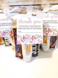 three bags of baby shower gels with thank you notes on the front and back