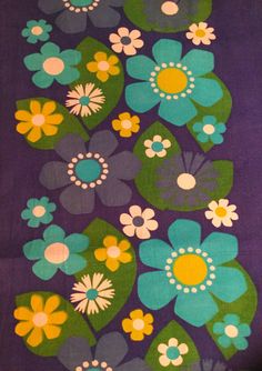 an area rug with flowers on it in purple, green and yellow colors is shown