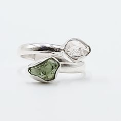 Divine Elegance Elevate your style with our exquisite Herkimer Diamond & Moldavite Ring, set in gleaming sterling silver. This stunning piece combines the celestial brilliance of Herkimer diamonds with the otherworldly energy of Moldavite, creating a ring that radiates elegance and power. Perfect for those who appreciate unique and spiritually significant jewelry, this ring is a true statement piece. Amplify Your Spiritual Journey Herkimer diamonds are renowned for their exceptional clarity and Si Clarity White Gold Open Ring Jewelry, Modern White Gold Rings With Si Clarity, Modern White Gold Diamond Ring With Si Clarity, Dazzling Diamond White Gemstone Ring, Si Clarity Modern Jewelry For Anniversary, Fine Jewelry White Gold Rings With Si Clarity, Dazzling Diamond White Rings With Gemstone, Wedding Jewelry In Diamond White With Si Clarity, Round Cut Jewelry With Si Clarity For Anniversary