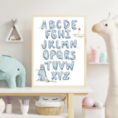 a poster with the letters and numbers in blue on a shelf next to a toy elephant