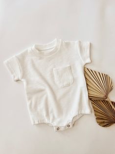 Cotton Ribbed Onesie In Solid Color, Ribbed Cotton Onesie, Solid Color Cotton Ribbed Onesie, White Bodysuit For Spring Loungewear, White Short Sleeve Bodysuit For Summer, Everyday Summer Bodysuit With Short Sleeves, Everyday Short-sleeved Summer Bodysuit, Cotton Short Sleeve Bodysuit For Summer, Cotton Ribbed Solid Color Bodysuit