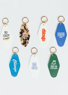 six key chains with different colored tags attached to them