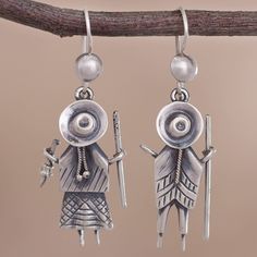 Depicting a Cuzco couple these dangle earrings are crafted of sterling silver adding a touch of Peruvian culture to your wardrobe. Quipac works to capture the spirit of his country detailing the duo wearing large hats with braided hair and traditional clothing. Symbolic Sterling Silver Earrings With Oxidized Finish, Peruvian Culture, Hummingbird Earrings, The Duo, Large Hats, Braided Hair, Silver Dangle Earrings, Jewelry Tree, Sterling Silver Dangle Earrings