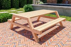 a wooden bench sitting on top of a brick patio