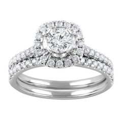 an engagement ring set with a round diamond center surrounded by two rows of white diamonds