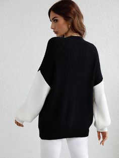 Our Estatia Knit Sweater comes in a beautiful colour blocking in the shades of black and white. So cosy you wouldn't want to take it off, this jumper features a crew neck, long drop sleeves and contrasting hues for a stylish drama. Pair it with our luxe ankle boots or trendy leather boots be the talk of the town! Size Guide: Ambre is 5’2” tall, and has a 33.2” bust, 24.5”waist, & 36.7” hips. She is wearing a S / US 4 / AU 8. This sweater is true to size. Feature: Long relaxed sleeves. Crew neckl Black Crew Neck Trendy Cardigan, Cozy Black Crew Neck Cardigan, Cozy Crew Neck Black Cardigan, Oversized Black Crew Neck Cardigan, Black Knit Cardigan With Ribbed Cuffs, Winter Crew Neck Sweater With Contrast Color, Trendy Black Sweater With Ribbed Cuffs, Oversized Long Sleeve Sweater With Contrast Color, Trendy Crew Neck Sweater With Contrast Color