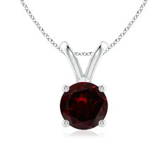 Crafted in  platinum, this classic solitaire garnet pendant enthralls with its feminine charm. Linked to a lustrous v-bale is a four-prong set garnet that mesmerizes with its intense red hue. Garnet Pendant, Solitaire Pendant, Elevate Your Look, Prong Setting, Garnet, Diamond Necklace, Platinum, 18k Gold, Silver Necklace