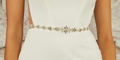 Rhinestone Wedding Belt Sash BT2471 Complete your modern bridal ensemble with this charming rhinestone and pearl beaded belt by enVogue. Featuring a delightful beaded design on organza ribbon, this dainty belt will be an enchanting complement to your wedding gown. Belt self-ties with ivory organza ribbon ties. Size: Total ribbon length is 84" long. Design size is 13.5" long and 1.25" wide at the center peak. Color: Ivory/Silver. Style: BT2471. Please allow 1 week for delivery. Shipping Policy . Elegant Crystal Bridal Belt, Elegant Beaded Silver Sashes, Elegant Silver Beaded Sash, Elegant Crystal Wedding Sashes, Elegant Silver Bridal Belt For Bridesmaids, Elegant Beaded Bridal Belt, Elegant Beaded Fitted Bridal Belt, Elegant Rhinestone Bridal Belt For Bridesmaids, Elegant Beaded Wedding Sashes