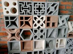 a wall made out of cement blocks with different shapes and sizes