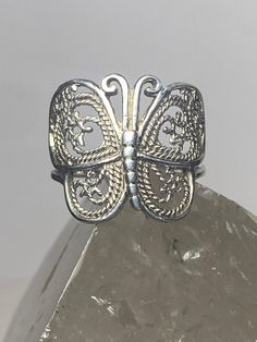 "Butterfly ring filigree band sterling silver women girls Size 6.75 Weight 3.4g Widest part 3/4\" Thinnest part 1/8\" Free Shipping & Free Postal Insurance Delivered in a Gift Box If you do not want the ring polished and want to leave the natural patina please let me know at the time of purchase as I do polish rings before I ship rings out. Thanks Free First Class shipping and postal insurance is included. If you want to upgrade to priority kindly pay an additional fee to do so. This is recommen Poison Ring, Butterfly Ring, Star Butterfly, Clear Stone, Garnet Rings, Pearl Ring, Silver Band, Rings Statement, Silver Fashion