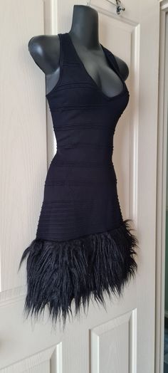 Mini Black Dress with Fur Trim on the bottom Very Goth 2000s Y2k Size Small. Will fit size 6-8 however it is very stretchy material so I believe even size 10 it will fit. Stretch Punk Club Dress, Black Fitted Emo Mini Dress, Fitted Emo Dress For Night Out, Fitted Punk Style Mini Dress For Party, Black Fitted Mini Dress For Cosplay, Fitted Emo Style Dress For Night Out, Punk Style Stretch Mini Dresses, Edgy Fitted Cosplay Dress, Alternative Black Mini Dress For Club