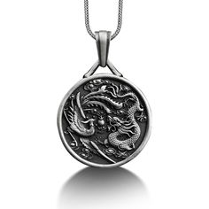 Phoenix and Dragon Engraved Necklace, Sterling Silver Personalized Necklace, Dragon Phoenix Jewelry, Customizable Necklace, Memorial Gift These 925K Sterling Silver Phoenix and Dragon Engraved Necklace photos are taken with original and every item has handmade engraving details. It's very elegant and classy for everyday use but also can be preferred as a gift for friends and family for an eternal memorial. We prepared a new collection for your loved ones, and a gift selection from BySilverStone Antique White Gold Necklace With Large Pendant, Symbolic Round Large Pendant Jewelry, White Gold Jewelry With Large Round Pendant, Symbolic Sterling Silver Pendant Medallion Necklace, Symbolic Engraved Round Pendant Jewelry, Symbolic Stainless Steel Jewelry With Large Pendant, Engraved Coin-shaped Amulet Jewelry, Sterling Silver Coin-shaped Pendant, Oxidized Stainless Steel Medallion Jewelry