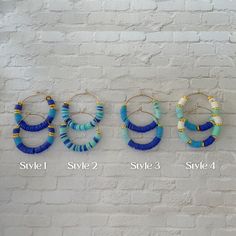 Hoop size: 35 mm / 1.37 inches  polymer clay heishi beads in beautiful shades of blue on gold plated wire hoops.  Need some summer hoops that are versatile and can be worn with casual outfits and night outfits? These simple hoops are for you! A pop of color or two bring a beautiful blue statement. Available in 4 styles.  *Only Style 2 may differ; not a deliberate pattern.