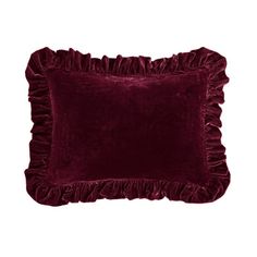 a velvet pillow with ruffles on the front and back, in dark purple