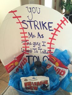 a bowl filled with candy and candies on top of a table next to a sign that says you strike me as the guy i want to take it too