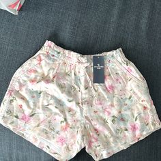 White With Flowers Front Tie Adjustable Relaxed Fit Bottoms For Spring Playwear, Spring Playwear Shorts With Pockets, Spring Playwear Summer Style Bottoms, Summer Style Bottoms For Spring Playwear, Relaxed Fit Shorts For Playwear, Spring Season, Relaxed Fit Shorts For Spring Playwear, Casual Playwear Bottoms For Summer, Casual Summer Playwear Bottoms, Spring Short Bottoms For Playwear