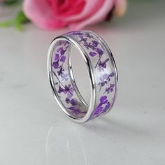 Resin ring meticulously crafted using real flowers and fully cured UV resin. The flowers silver ring is inspired by the graceful charm of Boho jewelry. This purple ring gift is a perfect meaningful gift for a beloved woman, and as a pampering gift for yourself. The jewelry is very flattering, lightweight, comfortable to wear as jewelry for everyday use and impressive as jewelry for a special occasion. Each piece is individually crafted to order, ensuring a unique touch, with subtle variations th Uv Resin Rings, Flower Shaped Rings With Pressed Flowers As Gifts, Flower Shaped Rings With Pressed Flowers, Flower Shaped Pressed Flowers Rings, Nature-inspired White Gold Flower Ring, Purple Flower Rings For Anniversary, Silver Flower-shaped Rings For Gift, Silver Flower Rings For Gift, Silver Flower Rings With Birth Flower Detail