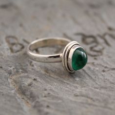 Lab Grown Emerald Ring, Sterling Silver Ring, Handmade jewelry, Stacking Ring, May Birthstone, Everyday Ring, Personalized Ring For Mom, Minimalist Emerald is known as the "stone of successful love".  It brings loyalty and provides for domestic bliss. It ensures physical, emotional and mental equilibrium, bringing harmony to all areas of ones life. This listing is for the following 1 (ONE) ring: ✦Gemstone :          Lab Created Emerald  ✦Stone Shape :      Oval Cabochon ✦Metal:                    925 Sterling Silver Dear customer you will receive the same piece or identical as shown in the picture. Since all gemstones are different from each other, I cannot guarantee the availability of the gemstone shown in the picture, but can guarantee you the same quality.  Visit My Shop  https://www.e Ring For Mom, Thoughtful Wedding Gifts, Jewelry Stacking, Smaragd Ring, Types Of Gems, Lab Created Emerald, Everyday Ring, Fine Silver Jewelry, Personalized Ring