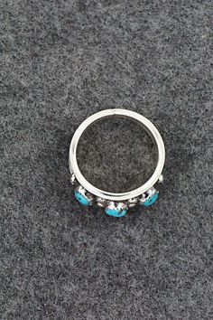 This turquoise and sterling silver ring was made by Navajo silversmith Paul Largo. The inside is stamped sterling.Size: 10Length: 1/2"Free shipping on all orders! We ship with USPS and always include tracking. All orders ship within a day of payment.Returns are accepted up to 30 days after you receive your order. Just send us a message. Our shop offers cash back or store credit. The item must be returned in new condition. Sterling Silver Turquoise Rings With Concho Detail, Sterling Silver Turquoise Ring With Concho, Turquoise Sterling Silver, Sterling Silver Ring, Silver Ring, Sterling Silver Rings, Silver Rings, Size 10, Turquoise