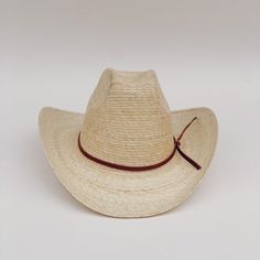 The Meadow straw cowboy hat is lightweight, durable. It's the prefect summer hat for a day at the beach or while cruising around town. These hats are individually handcrafted with sustainable palm leaf and naturally tanned leather by artisans in Guerrero, Mexico, in a fair trade environment. Each hat is unique and may vary in size and color and have small imperfections. -Crown height: 5.0", Brim length: 4.0" curved up brim -Removable naturally tanned brown leather band***leather band may vary fr Natural Brimmed Hat For Ranch, Natural Handwoven Toquilla Straw Hat Bands, Handwoven Natural Toquilla Straw Hat Bands, Natural Color Hat With Curved Brim For Country Events, Flat Brim Natural Hat For Ranch, Natural Brimmed Hat For Rodeo, Natural Curved Brim Hat For Country Events, Natural Color Curved Brim Hat For Country Events, Artisan Natural Hat Band For Beach