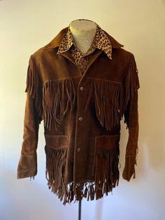 "This jacket, in beautiful Vintage condition, fits like a men's large size 40 and measures at: Chest: 40\" Arm: 23\" Length (back of neck to bottom fringe): 32\" No weird smells or apparent problems." Brown Leather Outerwear For Festivals, Brown Leather Festival Outerwear, Western Style Brown Leather Jacket For Winter, Brown Western Leather Jacket For Winter, Bohemian Brown Leather Jacket For Winter, Fitted Western Brown Outerwear, Western Style Brown Long Sleeve Outerwear, Brown Western Long Sleeve Outerwear, Fitted Brown Western Outerwear