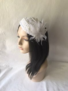 This is a vintage inspired half hat feather flower fascinator ideal for wedding, bridal tea party, mother of the bride, COGIC church hat or any other formal special occasion. Lightweight Can be worn either side Alligator clips underneath or elastic band White Gatsby Style Fascinator For Evening, Vintage White Fascinator For Evening, Vintage White Evening Fascinator, Vintage White Headpieces For Wedding, White Vintage Wedding Costume Hats And Headpieces, Vintage Wedding Headband Fascinator, White Hat For Vintage Events, Vintage White Hat Headpiece, Vintage White Costume Hats For Wedding