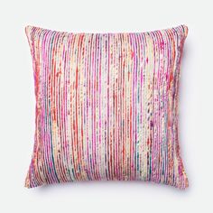 a multicolored striped pillow on a white background with pink, red and blue stripes