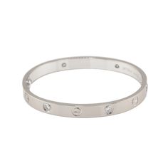 Cartier Love Bracelet in 18K White Gold set with 4 brilliant-cut diamonds totaling 0.42 carats Total Diamond Weight: 0.42ct Bracelet Size: 16 Created in New York in 1969, the LOVE bracelet is an icon of jewelry design: a close-fitting, oval bracelet composed of two rigid arcs which is worn on the wrist and removed using a specific screwdriver. The closure is designed with two functional screws placed on either side of the bracelet. Ref. B6070117 SKU: CAR01380 Original box and original papers Ple Oval Bracelet, White Gold Set, Love Bracelet, Cartier Love, Cartier Love Bracelet, Love Bracelets, Gold Set, Brilliant Cut Diamond, Bracelet Sizes