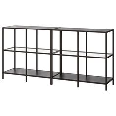 two black shelves with one shelf on each side and the other is open for storage