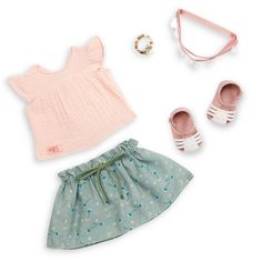 a doll outfit with shoes and accessories on a white background