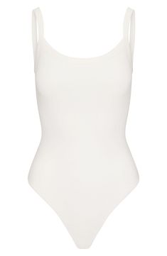 This fitted bodysuit from Kim Kardashian's SKIMS gives the look of a tucked-in camisole—making it perfect for everyday wear. Snap closure Scoop neck Sleeveless 90% cotton, 10% spandex Machine wash, tumble dry Imported Spring Bodysuit With Built-in Bra And Scoop Neck, Summer Tank Bodysuit With Built-in Bra, Summer Second-skin Smoothing Tops, Fitted Sleeveless Bodysuit For Everyday, Fitted Smoothing Tops For Summer, Everyday Fitted Sleeveless Bodysuit, Chic Fitted Everyday Bodysuit, Summer Fitted Camisole With Scoop Neck, Chic Everyday Fitted Bodysuit