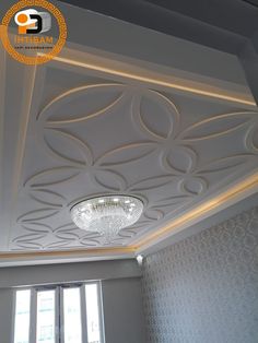 the ceiling in this room is decorated with white paint and decorative designs, including circles