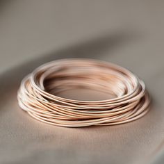 Modern Adjustable Rose Gold Bracelets, Adjustable Rose Gold Classic Bracelets, Adjustable Classic Rose Gold Bracelets, Classic Adjustable Rose Gold Bracelets, Minimalist Stackable Bracelets For Everyday, Modern Stackable Bracelets For Layering, Elegant Stackable Bangle Wrap Bracelet, Elegant Bangle Bracelets For Layering, Modern Rose Gold Bracelets For Everyday Wear