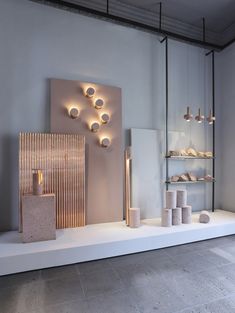 a white display case filled with lots of different types of lights and objects on top of it